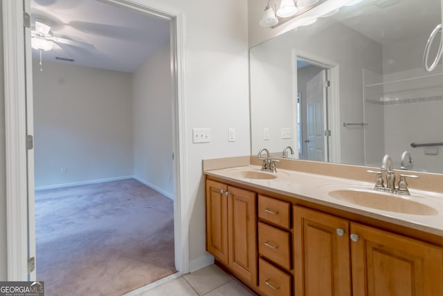 bathroom with tile patterned flooring, ceiling fan, and vanity