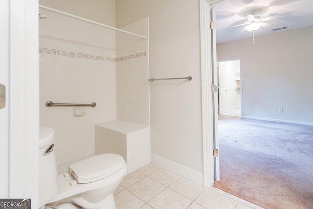 bathroom with tile patterned floors, ceiling fan, and toilet