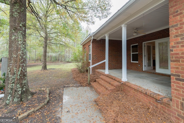 view of yard with ceiling fan