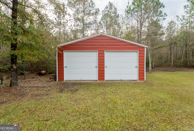 garage featuring a yard