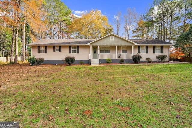 single story home featuring a porch and a front yard