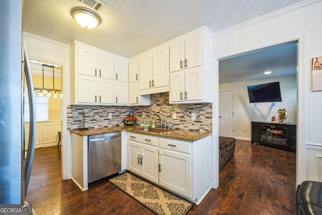 kitchen with white cabinets, dark hardwood / wood-style floors, sink, and stainless steel appliances