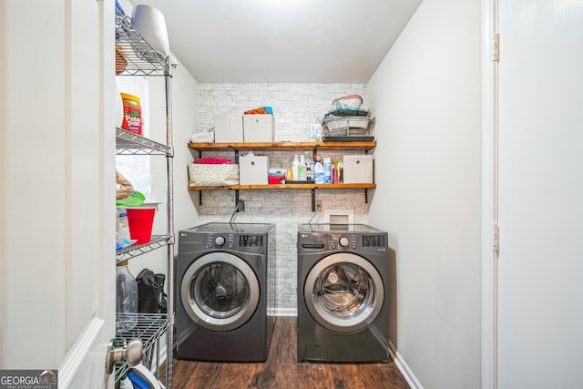 laundry room with dark hardwood / wood-style floors and independent washer and dryer