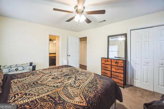 bedroom featuring carpet, ceiling fan, and ensuite bathroom