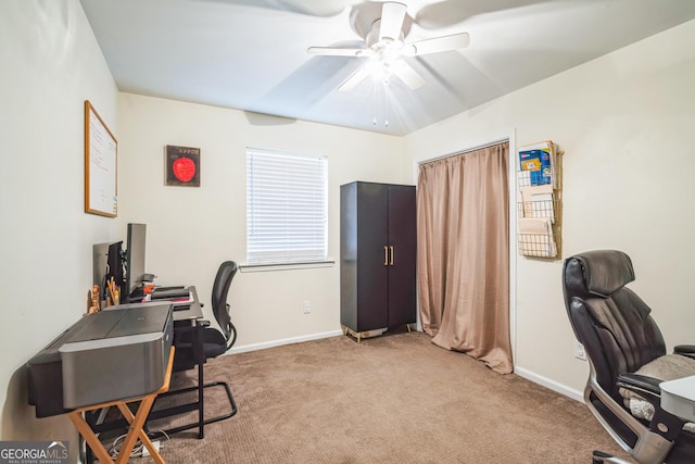 home office featuring ceiling fan and light colored carpet