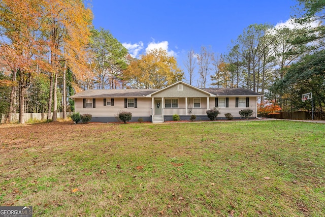 ranch-style home featuring a porch and a front yard