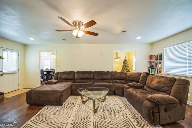 living room with ceiling fan and hardwood / wood-style floors