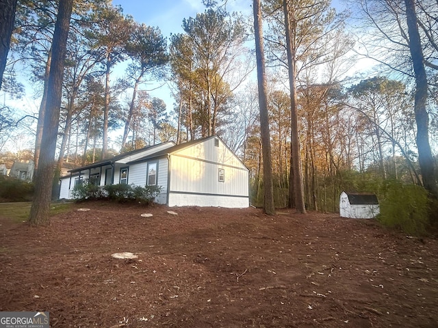 view of home's exterior with a shed