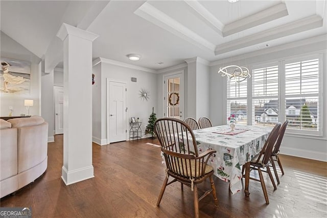 dining area with a chandelier, dark hardwood / wood-style flooring, and crown molding