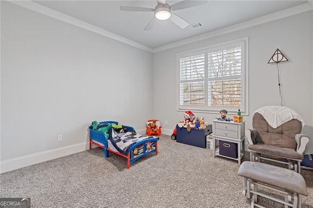 carpeted bedroom featuring ceiling fan and ornamental molding