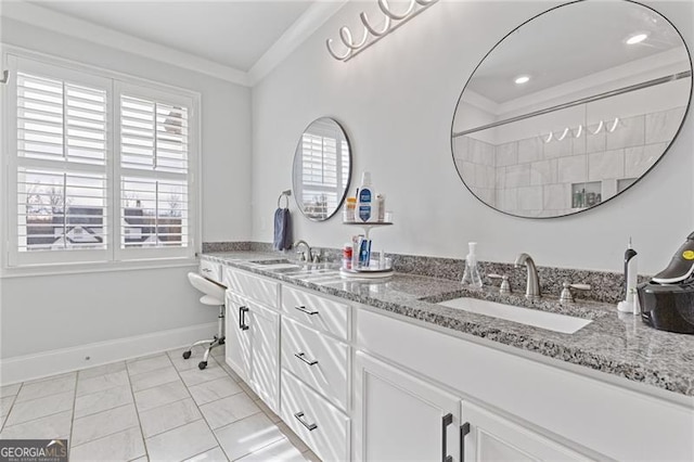 bathroom featuring tile patterned flooring, vanity, ornamental molding, and a wealth of natural light