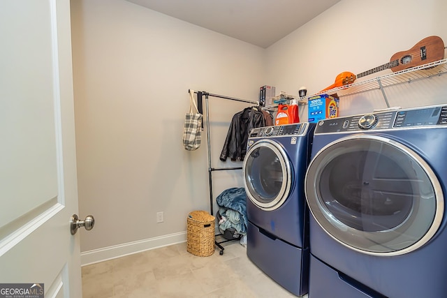 washroom with washer and dryer