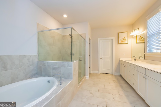 bathroom featuring tile patterned floors, vanity, and plus walk in shower