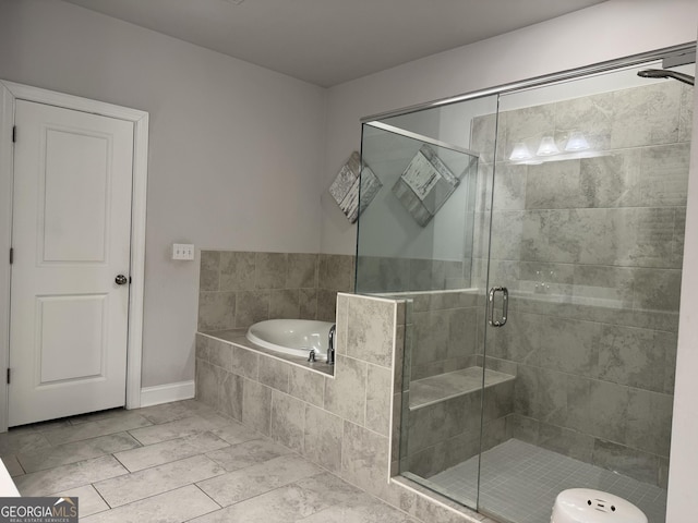 bathroom with tile patterned flooring and plus walk in shower