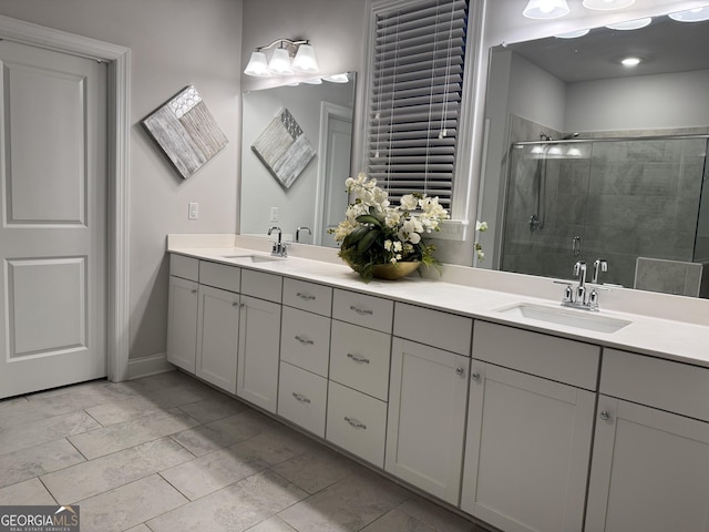 bathroom featuring vanity and a shower with shower door