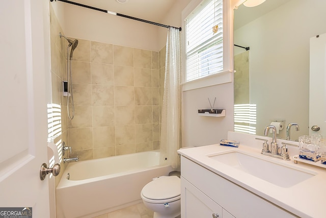 full bathroom with tile patterned flooring, shower / tub combo with curtain, vanity, and toilet