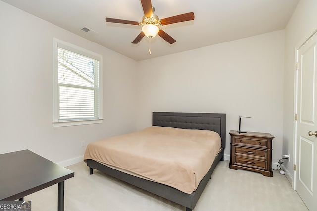 bedroom featuring ceiling fan and light carpet