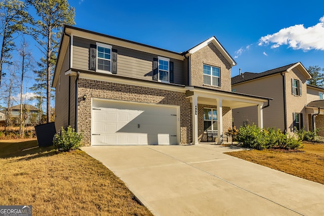 view of front of property with a porch and a garage