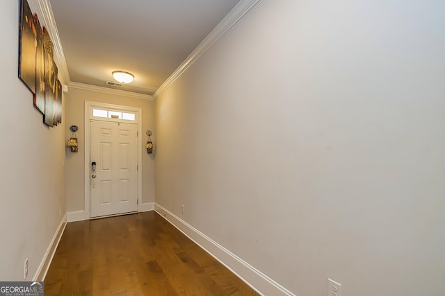 doorway with dark hardwood / wood-style floors and crown molding