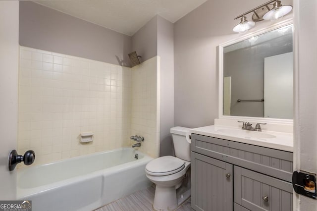 full bath with toilet, vanity, and shower / tub combination