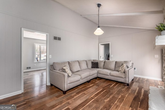 living room featuring dark wood-style floors, visible vents, baseboards, and lofted ceiling with beams