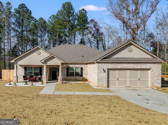 view of front of house with a garage and a front yard