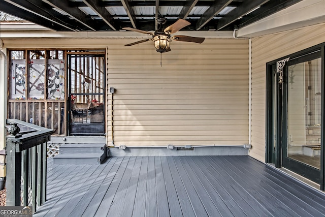 wooden deck with ceiling fan