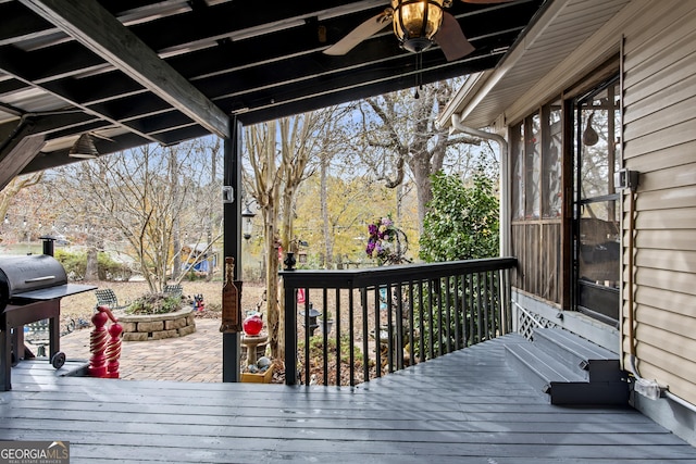 deck with ceiling fan and a grill