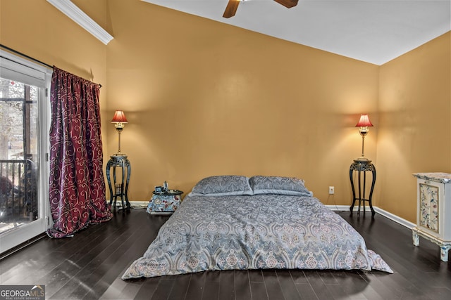 bedroom with dark hardwood / wood-style floors, vaulted ceiling, and ceiling fan