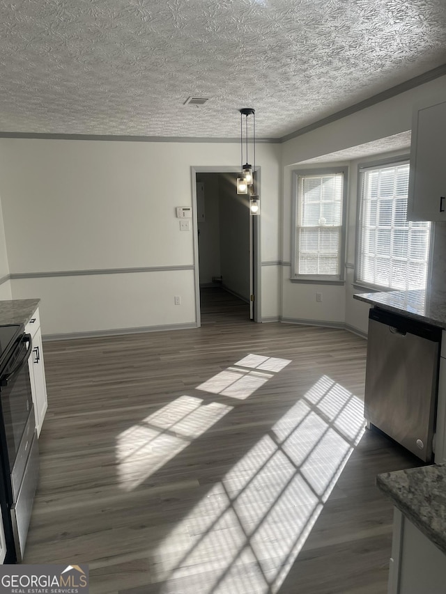 unfurnished dining area featuring dark hardwood / wood-style floors and ornamental molding