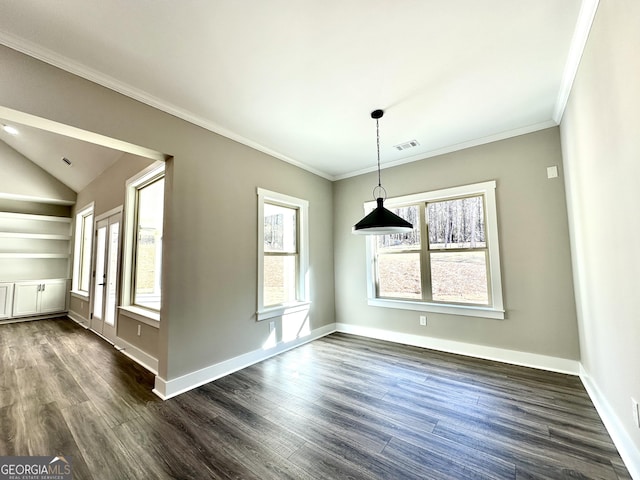 unfurnished dining area with baseboards, visible vents, lofted ceiling, dark wood-style floors, and ornamental molding