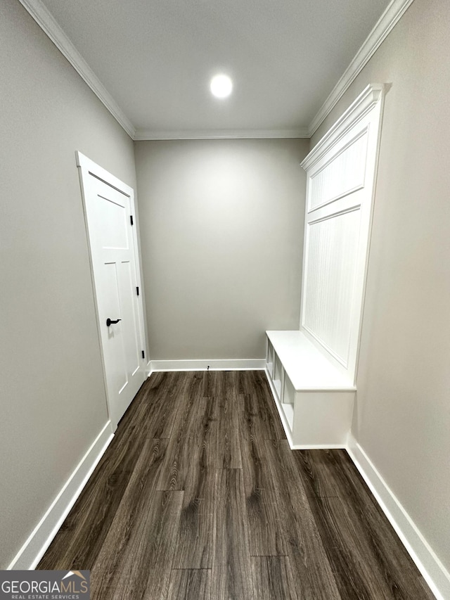 mudroom featuring baseboards, ornamental molding, and dark wood finished floors