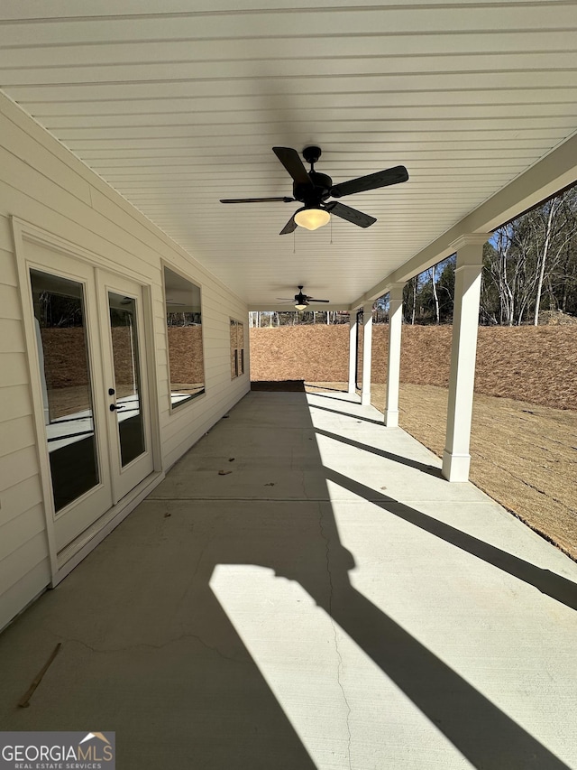 view of patio with french doors and ceiling fan