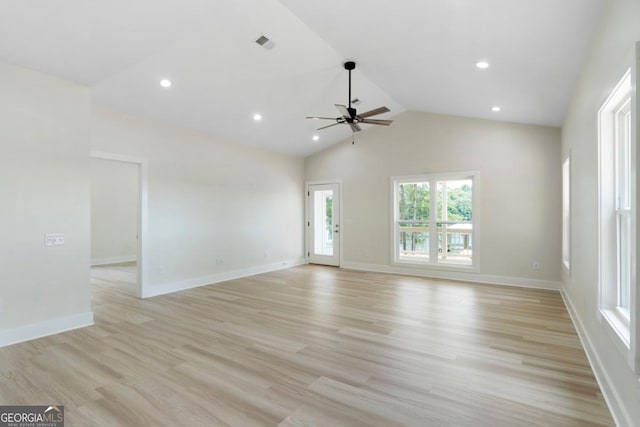 unfurnished room with ceiling fan, light hardwood / wood-style floors, and vaulted ceiling