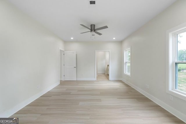 interior space featuring ceiling fan, light hardwood / wood-style flooring, and a healthy amount of sunlight