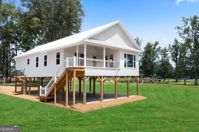 view of jungle gym featuring cooling unit, a lawn, and ceiling fan