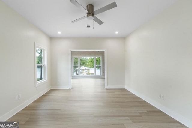 spare room with light hardwood / wood-style floors and ceiling fan