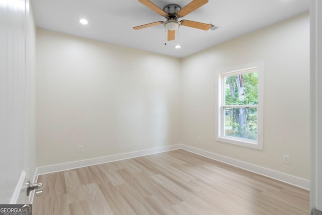 empty room with light wood-type flooring and ceiling fan