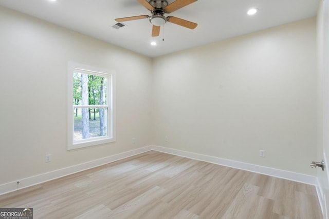 spare room featuring ceiling fan and light hardwood / wood-style floors