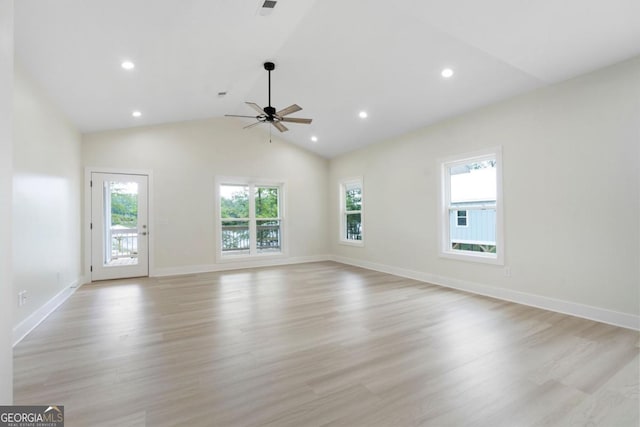 unfurnished living room with ceiling fan, light hardwood / wood-style floors, and lofted ceiling