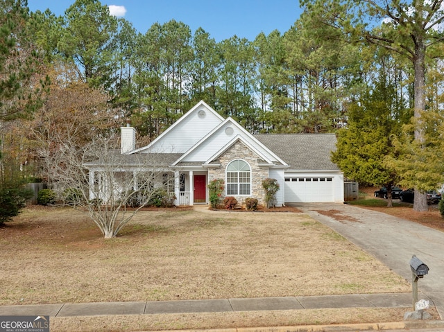 view of front of house with a front yard and a garage