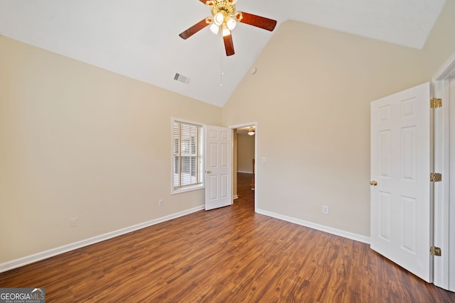 empty room featuring ceiling fan, high vaulted ceiling, and dark hardwood / wood-style floors