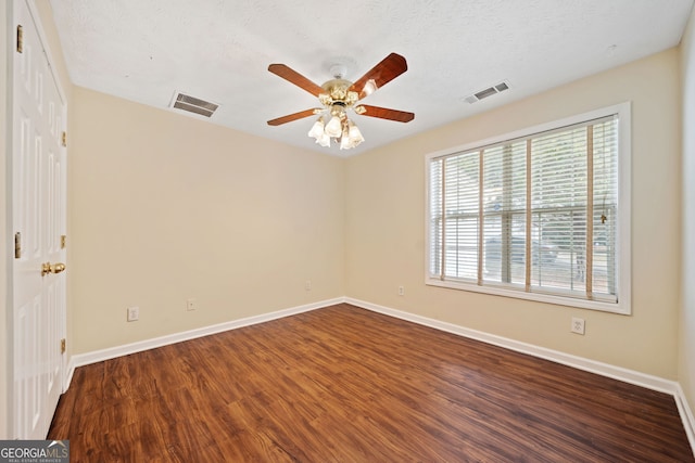 spare room featuring hardwood / wood-style floors, a textured ceiling, and ceiling fan