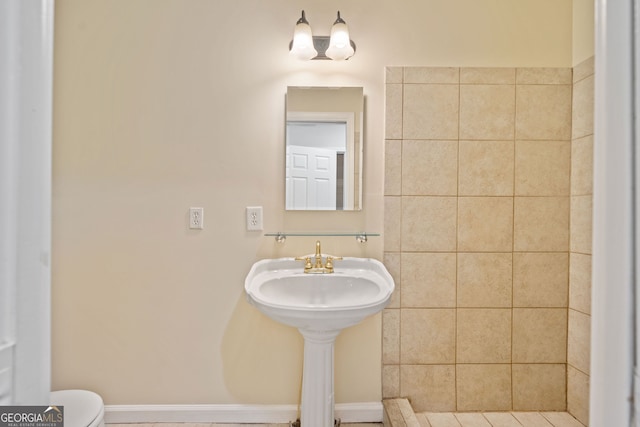 bathroom featuring tile patterned floors and toilet