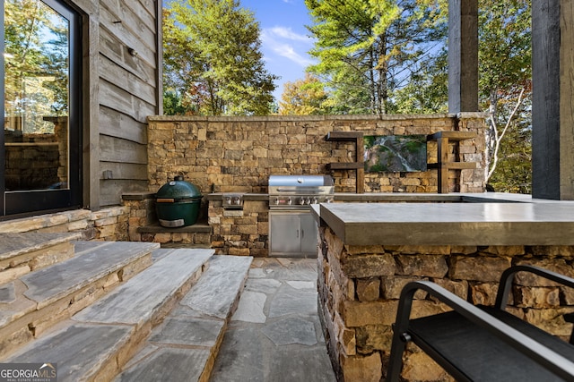 view of patio with grilling area and exterior kitchen