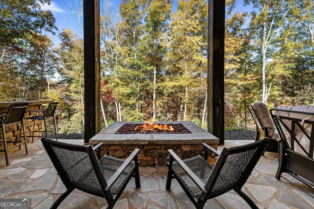 view of patio with an outdoor bar and an outdoor fire pit