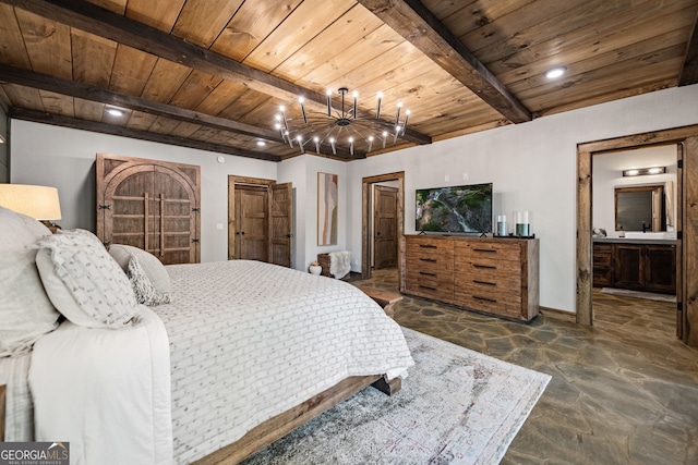 bedroom with a chandelier, ensuite bathroom, beamed ceiling, and wood ceiling