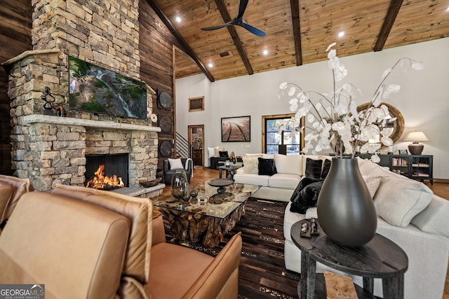 living room with a fireplace, high vaulted ceiling, wooden ceiling, and dark hardwood / wood-style floors