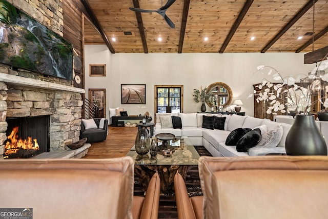 living room featuring ceiling fan, beam ceiling, wood-type flooring, and wooden ceiling