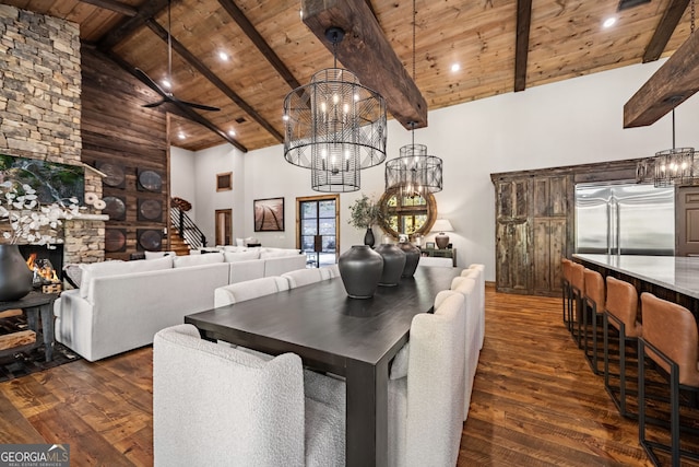 dining space featuring dark hardwood / wood-style flooring, wooden ceiling, and high vaulted ceiling